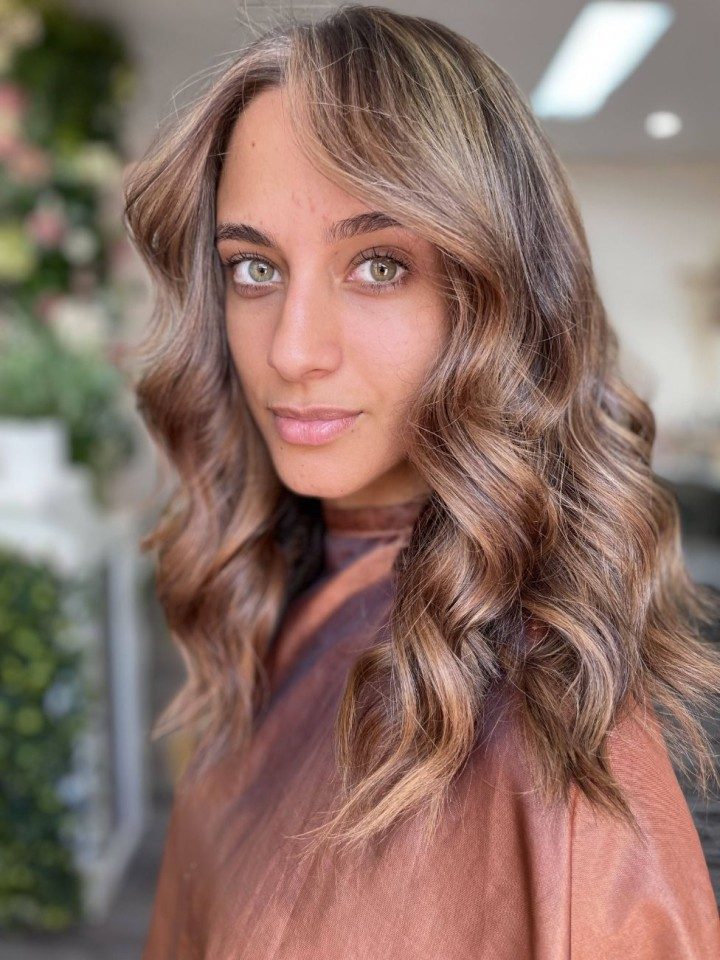 Girl with brunette hair at hair salon